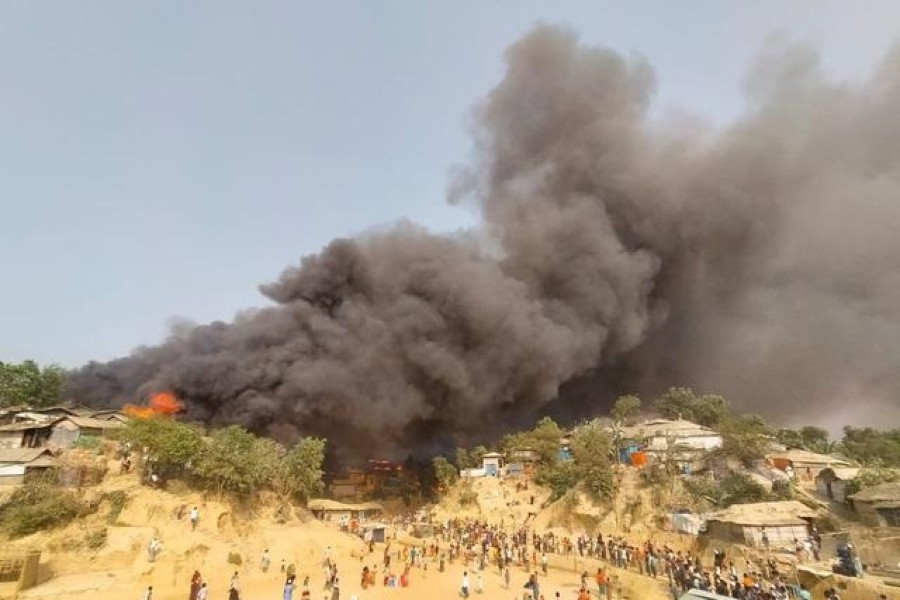 Smoke billows at the site of the Rohingya refugee camp where fire broke out in Cox's Bazar, Bangladesh, March 22, 2021 — Reuters/Stringer