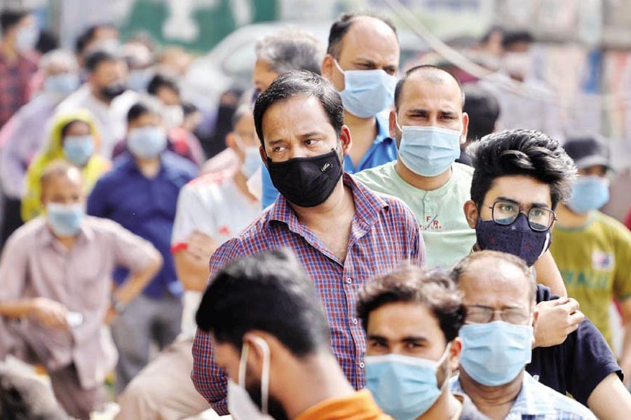 With Covid-19 cases surging again in the country, the queue of people waiting for coronavirus tests at Mugda General Hospital in the city is getting longer. The photo was taken recently —FE file photo