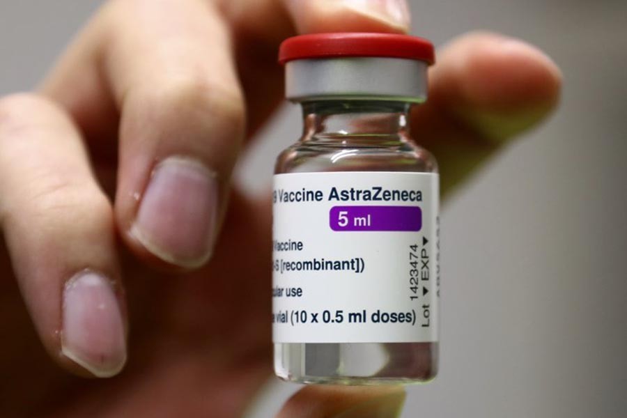 Medical staff prepares an AstraZeneca coronavirus vaccine during preparations at the vaccine center in Ebersberg near Munich, Germany, Monday, March 22, 2021. (AP Photo/Matthias Schrader)