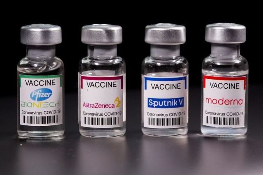 Vials with Pfizer-BioNTech, AstraZeneca, Sputnik V, and Moderna coronavirus disease (Covid-19) vaccine labels are seen in this illustration picture taken March 19, 2021 — Reuters/Illustration