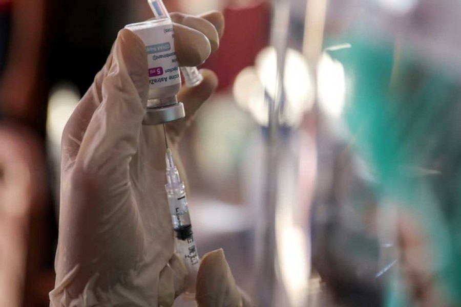 A healthcare worker prepares a dose of AstraZeneca coronavirus disease (Covid-19) vaccine during a mass vaccination program for Green Zone Tourism in Sanur, Bali, Indonesia, March 23, 2021 — Reuters/Files