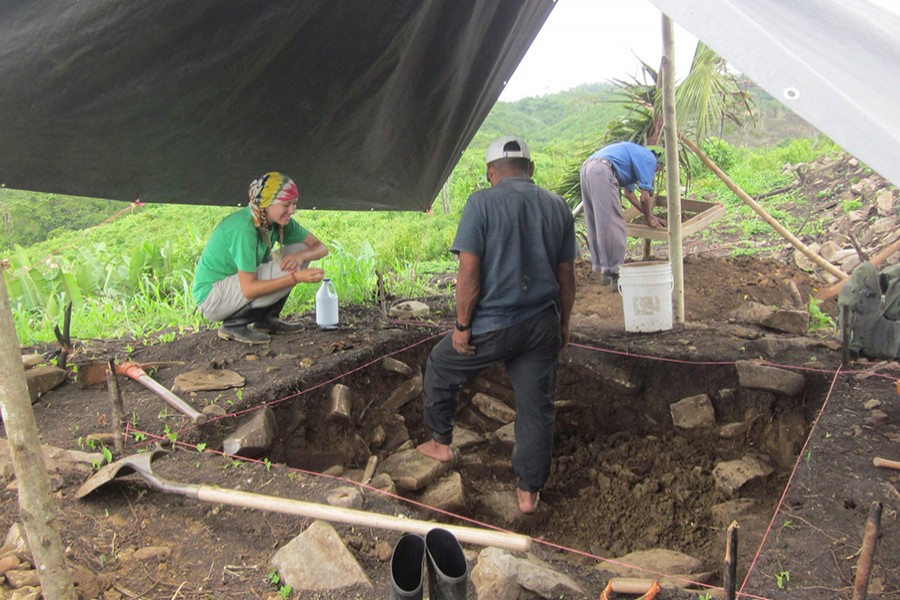 Amy Thompson speaks with members of the local community who worked with the team of researchers during excavations at the ancient Maya site of Uxbenka, Belize in April 2012 — Handout via Reuters