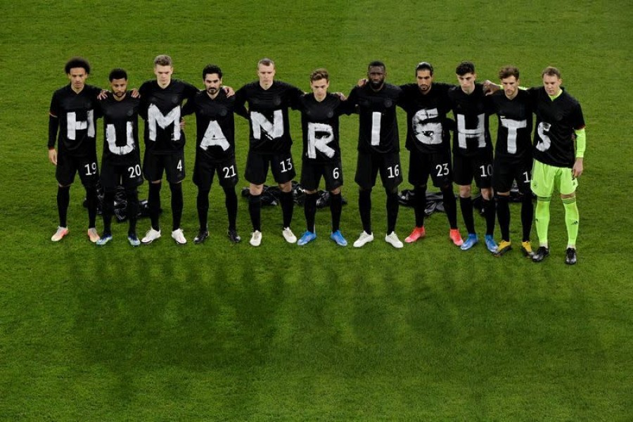 Germany players pose for a photo displaying a Human Rights message on their t-shirts before the match against Iceland on March 25, 2021 — Pool via Reuters