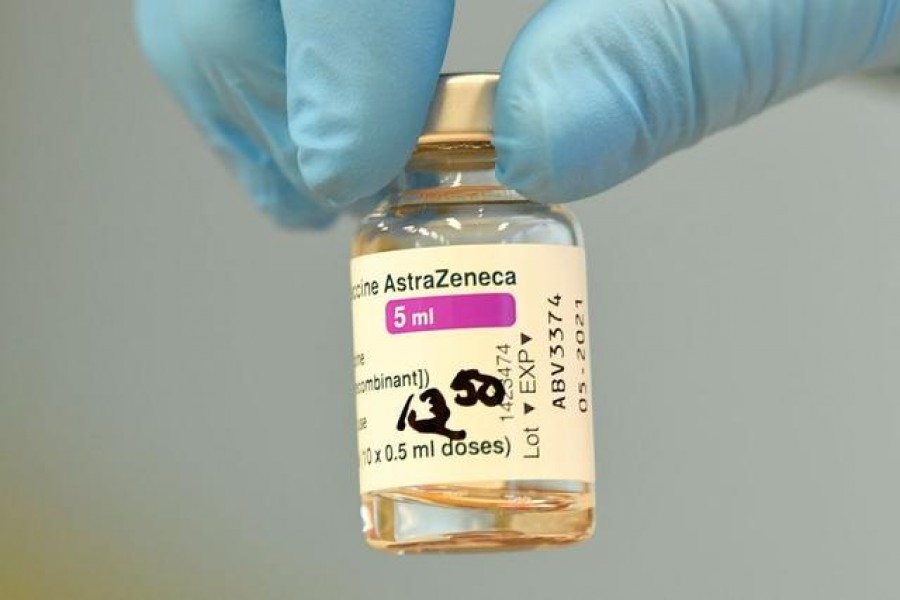 A vial with AstraZeneca's COVID-19 vaccine is prepared during a vaccination of teachers and nursery teachers, amid the spread of the coronavirus disease (COVID-19), in Grevesmuehlen, Germany, March 5, 2021. REUTERS/Fabian Bimmer/File Photo