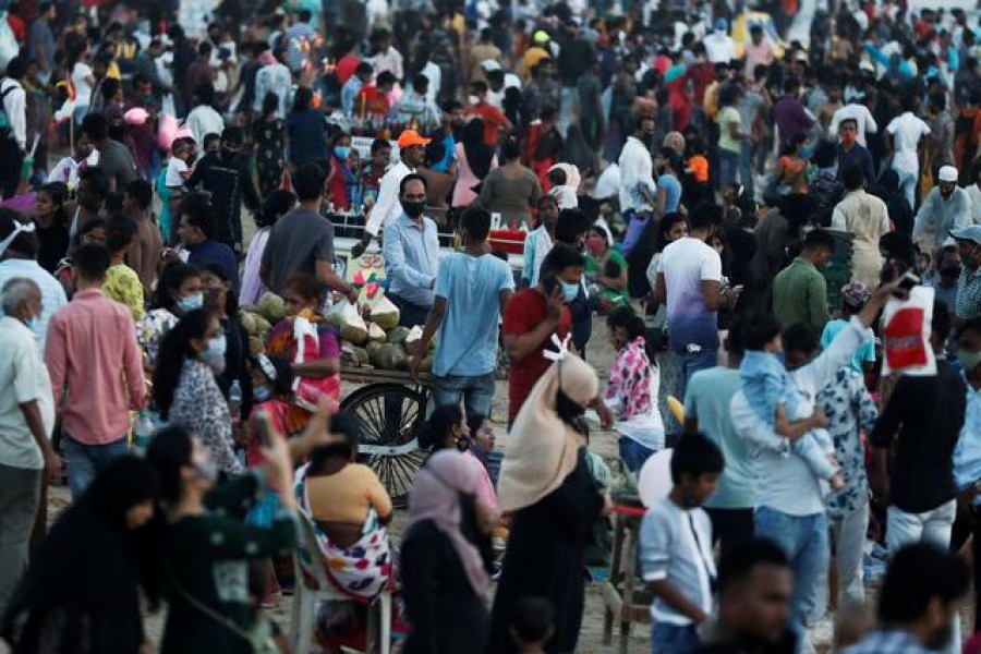 People walk or stand at a crowded beach amidst the spread of the coronavirus disease (Covid-19) in Mumbai, India on April 4, 2021 — Reuters photo