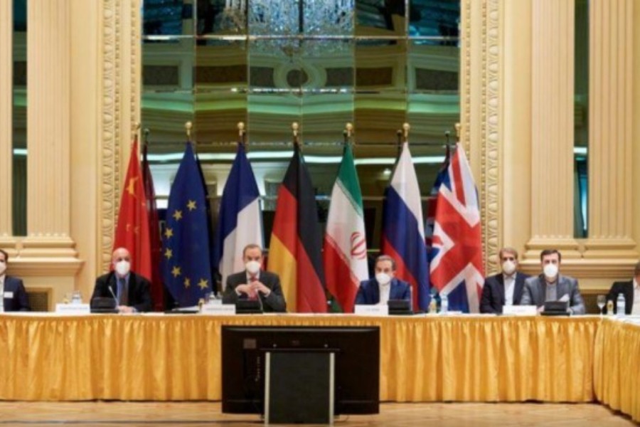 European External Action Service (EEAS) Deputy Secretary General Enrique Mora and Iranian Deputy at Ministry of Foreign Affairs Abbas Araghchi wait for the start of a meeting of the JCPOA Joint Commission in Vienna, Austria April 6, 2021. EU Delegation in Vienna/Handout via REUTERS