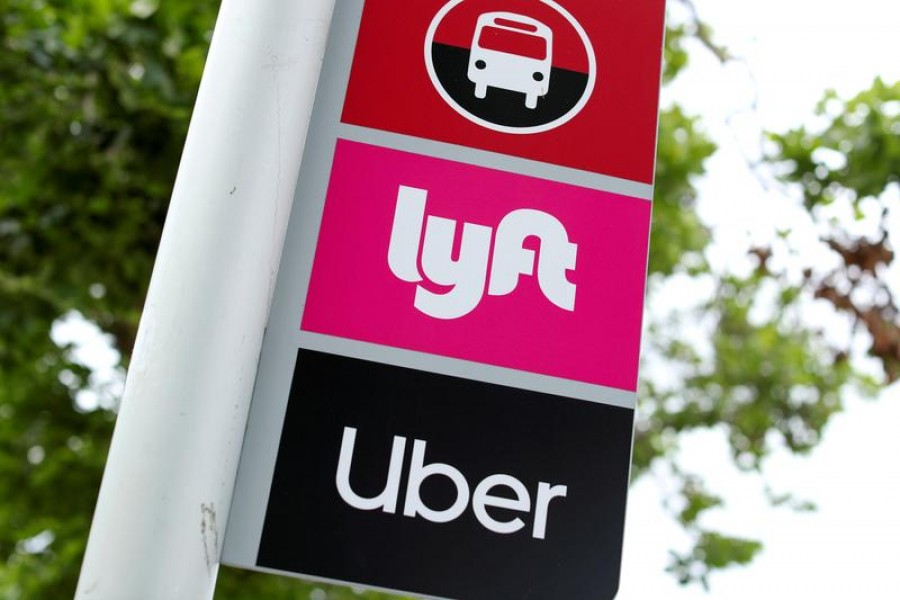 A sign marks a rendezvous location for Lyft and Uber users at San Diego State University in San Diego, California, US on May 13, 2020 — Reuters/Files