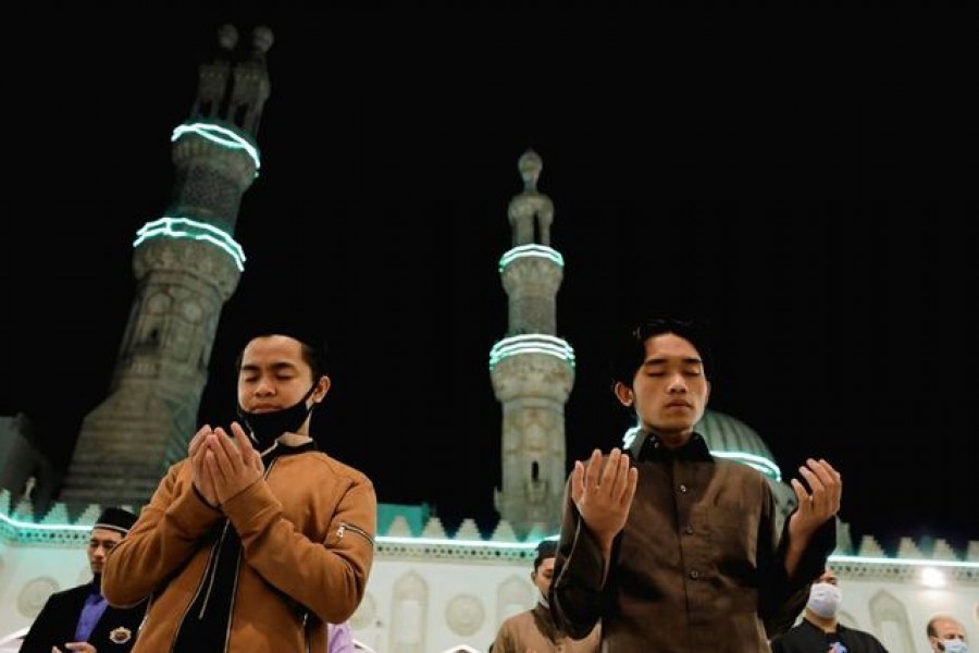 Muslims perform evening Taraweeh prayers inside Al-Azhar Mosque on the holy fasting month of Ramadan, amid the coronavirus disease (Covid-19) pandemic in the old Islamic area of Cairo, Egypt on April 13, 2021 — Reuters photo9