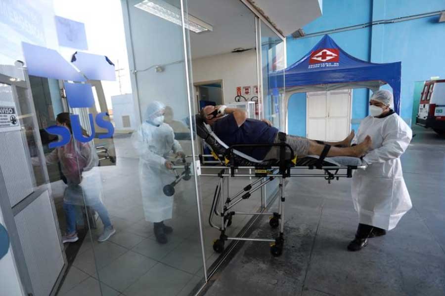 Members of an Emergency Mobile Care Service (SAMU) team transport a patient, who tested positive for the coronavirus disease (COVID-19), to a hospital in Brazil last month -Reuters file photo