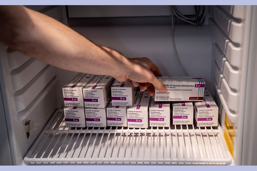 Staff member handles AstraZeneca COVID-19 vaccines in storage at Region Hovedstaden's Vaccine Centre, Copenhagen, Denmark February 11, 2021. REUTERS   