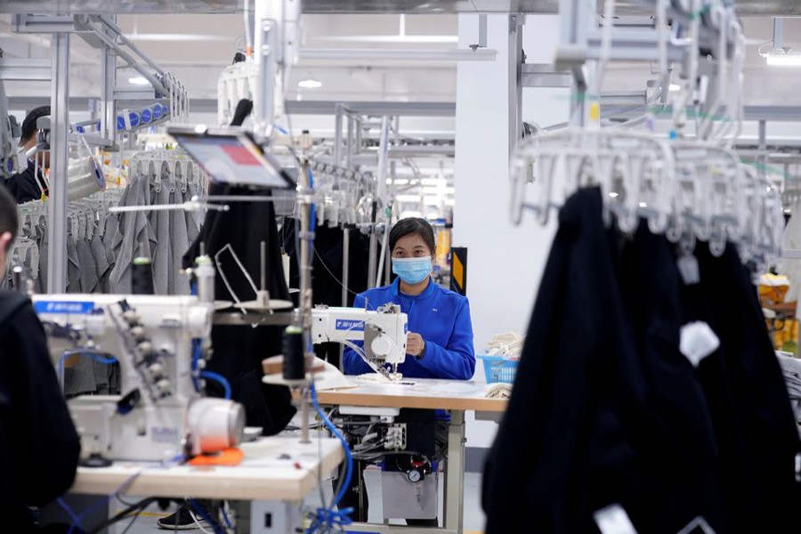 A worker works at Xunxi factory, which is an affiliate of Chinese e-commerce giant Alibaba, during a media tour, in Hangzhou, Zhejiang province, China on November 10, 2020 — Reuters/Files