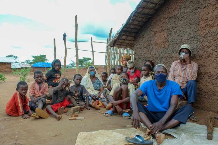 Herculano, 64 (in blue t-shirt) fled violence in Quissanga District in Cabo Delgado, with his whole family, including children and grandchildren -UNHCR photo