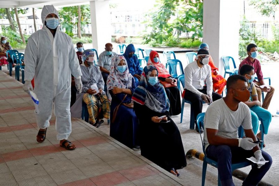 People sit as they come to a coronavirus testing centre in the Mugda Medical College and Hospital as the coronavirus disease (Covid-19) outbreak continues in Dhaka, Bangladesh, July 2, 2020 — Reuters/Files