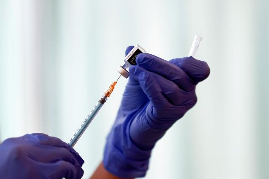 A medical worker fills a syringe with a dose of the Pfizer-BioNTech coronavirus disease (COVID-19) vaccine as Japan launches its inoculation campaign, at Tokyo Medical Center in Tokyo, Japan February 17, 2021. Behrouz Mehri/Pool via REUTERS