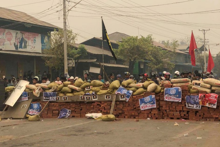 Protesters defend themselves from the troops in Kale, Sagaing region, Myanmar on March 28, 2021 in this picture obtained by Reuters