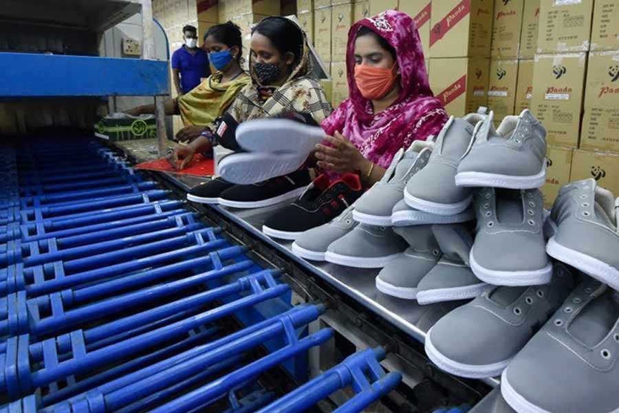 Workers making shoes at the factory of Panda Shoes Industries Ltd. in Gazipur recently -Xinhua photo