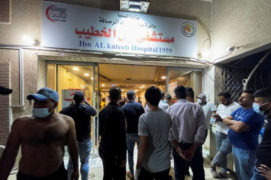 People gather at Ibn Khatib hospital after a fire caused by an oxygen tank explosion in Baghdad, Iraq, April 25, 2021. REUTERS