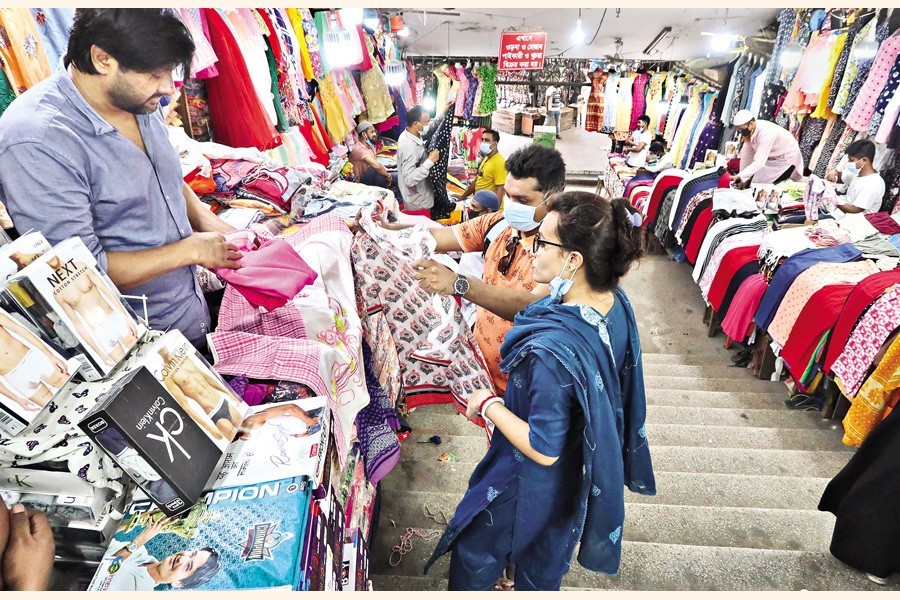 Shops reopen on Sunday after 11 days amid a strict lockdown but only few customers show up as is seen in this photo taken at New Market in the city — FE photo by Shafiqul Alam