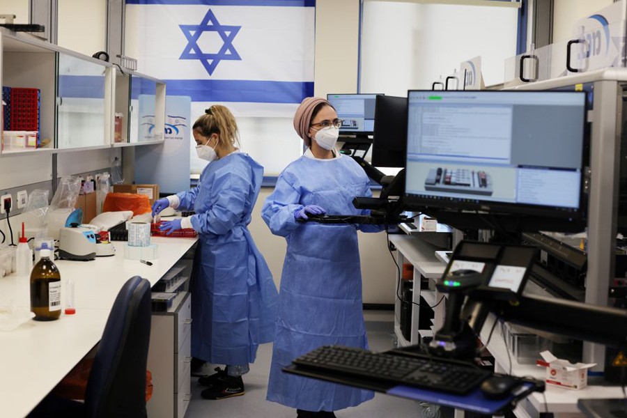 Technicians work at Healthcare Maintenance Organization (HMO) Maccabi's coronavirus disease (Covid-19) public laboratory, performing diverse and numerous tests, in Rehovot, Israel on February 9, 2021 — Reuters/Files