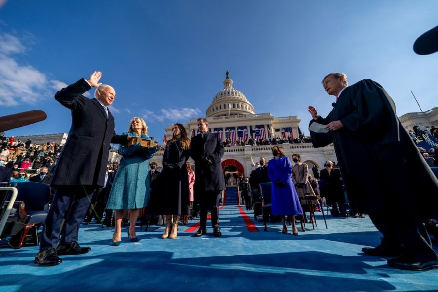 Joe Biden is sworn in as the 46th president of the United States by Chief Justice John Roberts as Jill Biden holds the Bible during the 59th Presidential Inauguration at the US Capitol, in Washington, US, January 20, 2021. Andrew Harnik/Pool via REUTERS/File Photo