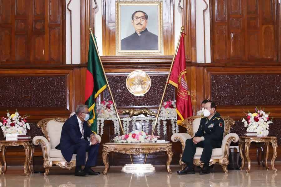 Visiting Chinese State Councilor and Minister of National Defense Wei Fenghe paying a courtesy call on President Abdul Hamid at Bangabhaban in Dhaka on Tuesday -Xinhua photo