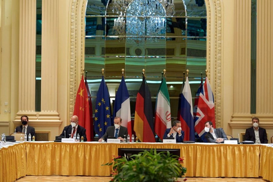 European External Action Service (EEAS) Deputy Secretary General Enrique Mora, Iranian Deputy at Ministry of Foreign Affairs Abbas Araghchi and Iran's ambassador to the UN nuclear watchdog Kazem Gharibabadi wait for the start of a meeting of the JCPOA Joint Commission in Vienna, Austria, May 1, 2021 — EU Delegation in Vienna/Handout via Reuters