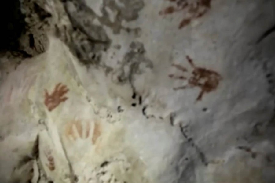 Hand prints, reportedly 1,200 years old, are seen on the cave walls, in Merida, Mexico April 2021, in this screengrab taken from a handout video. SERGIO GROSJEAN/Handout via REUTERS