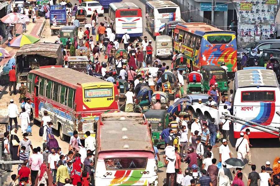 With the coronavirus-induced restrictions relaxed, buses dominate the road in Gulistan area of the city on Thursday — FE photo by Shafiqul Alam