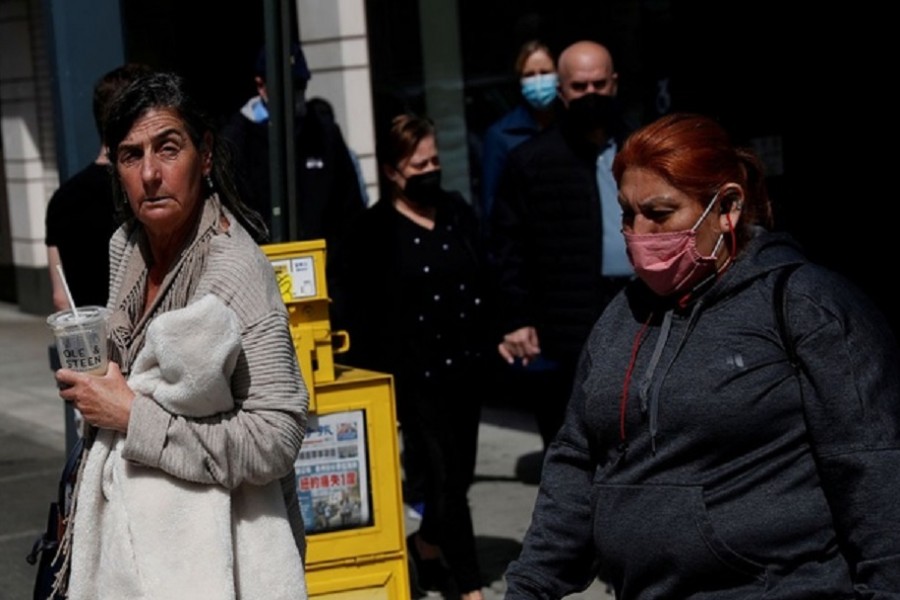 A woman walks without a protective face mask, after the Centers for Disease Control and Prevention (CDC) announced new guidelines regarding outdoor mask wearing and vaccinations during the outbreak of the coronavirus disease (COVID-19) in Manhattan, New York City, US, April 27, 2021. Reuters  A man wearing a protective mask stands outside Louis Vuitton luxury store at the Americana Manhasset open-air shopping complex in Manhasset, New York, US, May 3, 2021. Reuters A man wearing a protective mask stands outside Louis Vuitton luxury store at the Americana Manhasset open-air shopping complex in Manhasset, New York, US, May 3, 2021. Reuters  PreviousNext