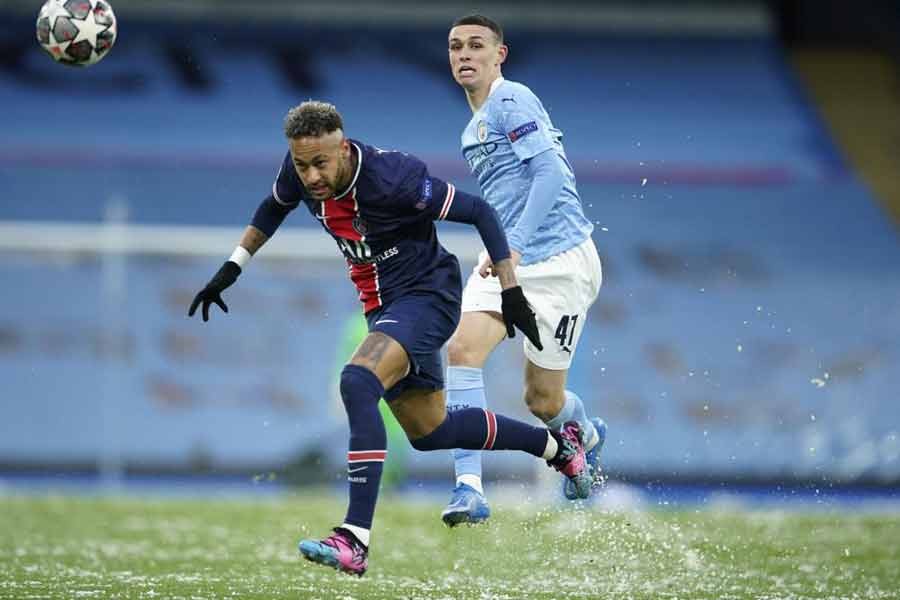 Manchester City's Phil Foden, right, challenges PSG's Neymar during the Champions League semifinal second leg soccer match between Manchester City and Paris Saint Germain at the Etihad stadium, in Manchester on May 4 -AP Photo