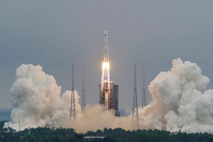 FILE PHOTO: The Long March-5B Y2 rocket, carrying the core module of China's space station Tianhe, takes off from Wenchang Space Launch Center in Hainan province, China April 29, 2021. China Daily via REUTERS