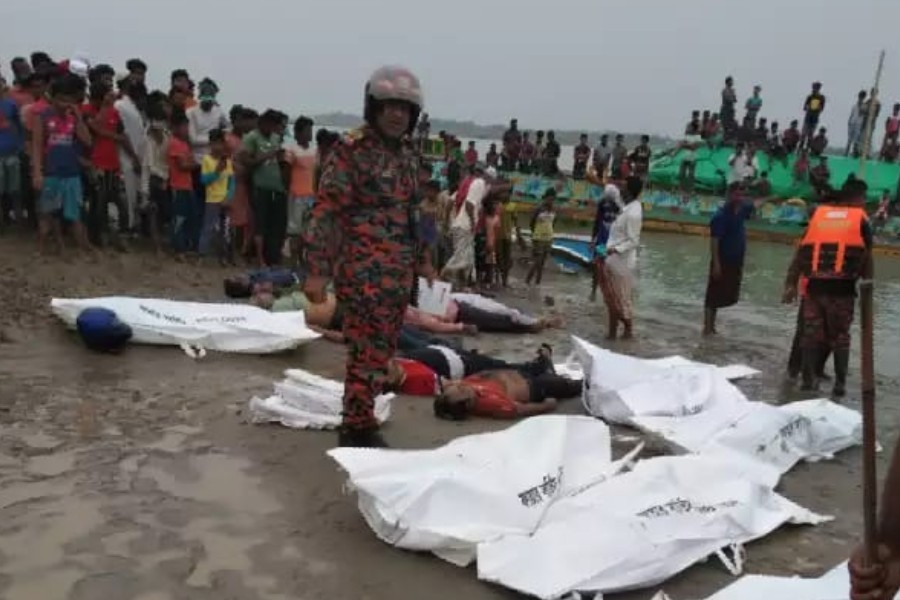 A speedboat is seen ashore after it collided with a sand-laden bulk carrier and sank on Padma River, in Madaripur, Bangladesh, May 3, 2021 — Reuters