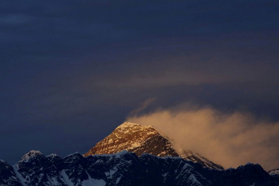 Light illuminates Mount Everest, during sunset in Solukhumbu District also known as the Everest region, November 30, 2015. REUTERS/Navesh Chitrakar/File Photo