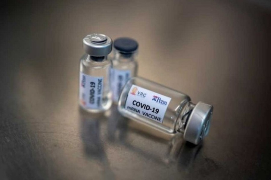 Small bottles labelled with a "Vaccine COVID-19" sticker and a medical syringe are seen in this illustration taken taken April 10, 2020. REUTERS