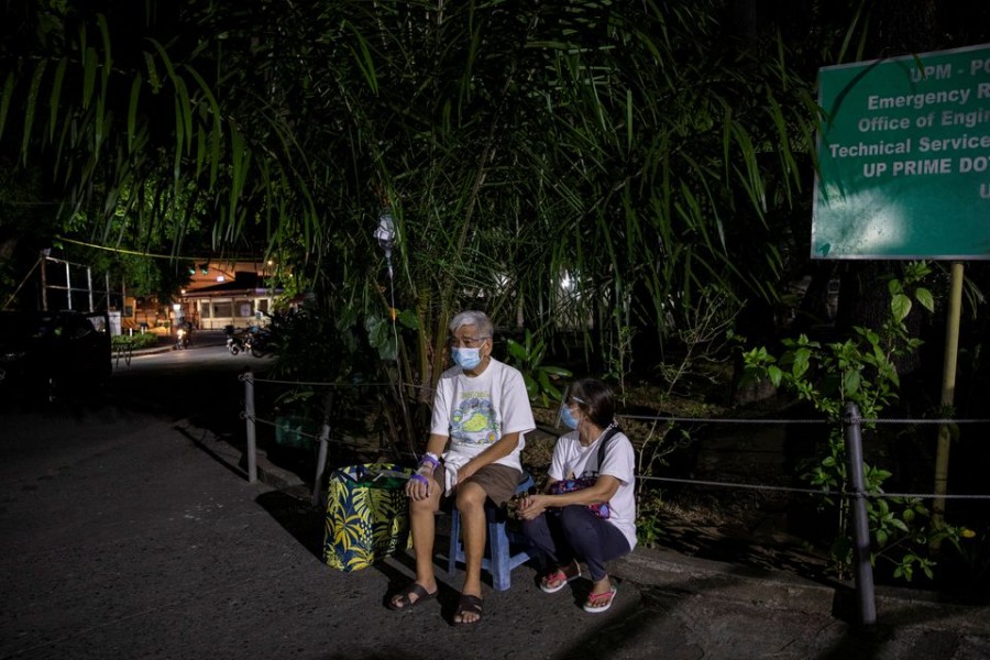 A patient at Philippine General Hospital is evacuated after a fire broke past midnight in the government-run facility amid the coronavirus disease (COVID-19) outbreak in Manila, Philippines, May 16, 2021. REUTERS/Eloisa Lopez