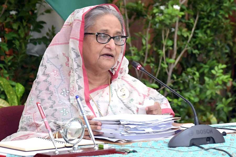 Prime Minister Sheikh Hasina presiding over a weekly cabinet meeting virtually from Ganabhaban on Monday –PID Photo