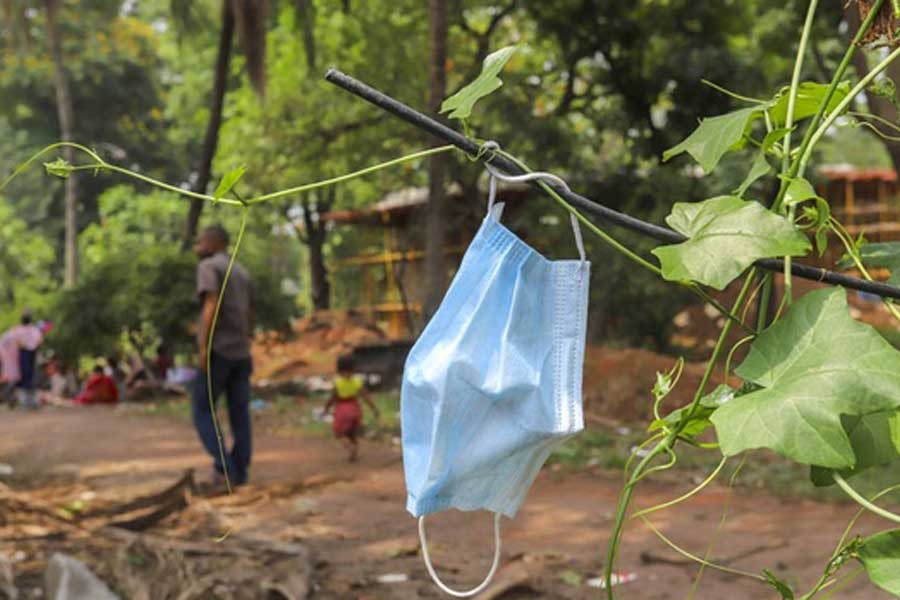 A mask discarded by some passerby is tangled among some vines at Dhaka’s Suhrawardy Udyan recently –bdnews24.com file photo