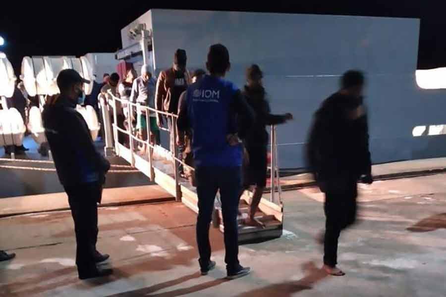 This photo provided by the International Organisation for Migration (IOM) Tunisia shows migrants disembarking in Tunisia late Monday –AP Photo