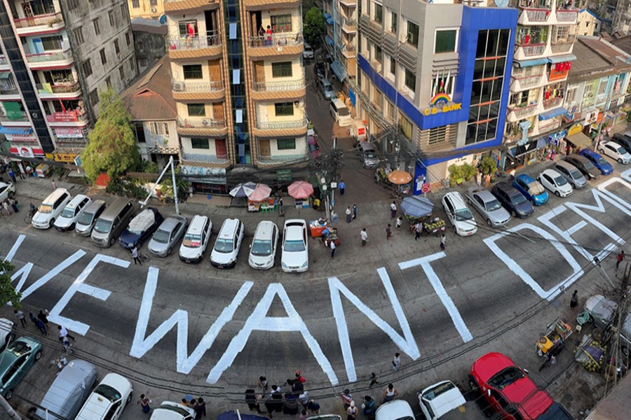 A slogan is written on a street as a protest after the coup in Yangon, Myanmar on February 21, 2021 — Reuters photo