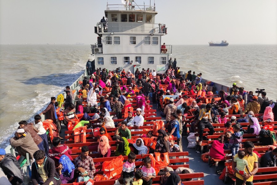 Rohingya refugees travel in a naval ship to be transported to an isolated island in the Bay of Bengal, in Chittagong, Bangladesh, Tuesday, Dec. 29, 2020. (AP Photo)