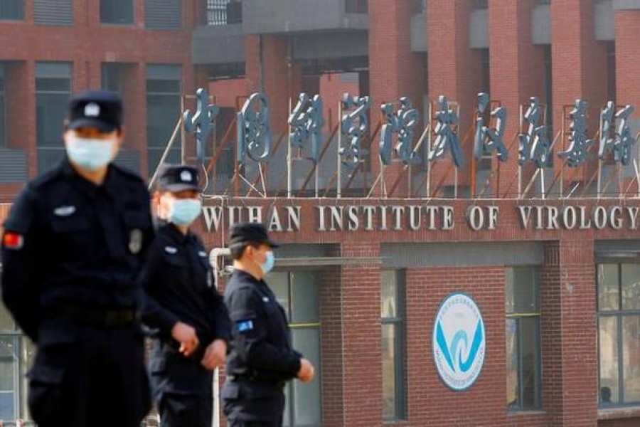 Security personnel keep watch outside the Wuhan Institute of Virology in Wuhan, Hubei province, China. File photo for representation. Photo Credit: Reuters