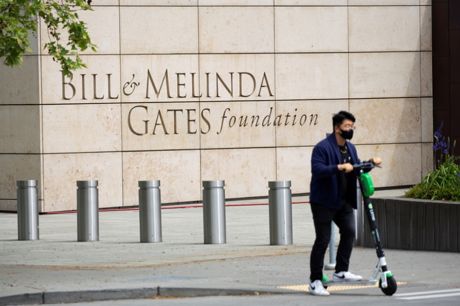 A person passes by on a scooter in front of the Bill & Melinda Gates Foundation in Seattle, Washington, US on May 5, 2021 — Reuters/Files