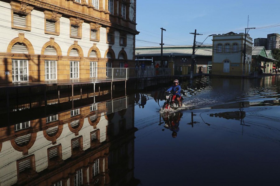 In Brazil's Amazonian, rivers swell to 100-year highs