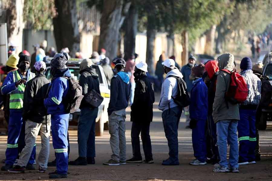 Job seekers standing outside a construction site in South Africa last year  -Reuters file photo