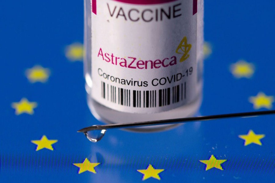 Vial labelled "AstraZeneca coronavirus disease (COVID-19) vaccine" placed on displayed EU flag is seen in this illustration picture taken Mar 24, 2021. REUTERS