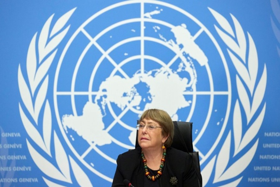 FILE PHOTO: UN High Commissioner for Human Rights Michelle Bachelet attends a news conference at the European headquarters of the United Nations in Geneva, Switzerland, December 9, 2020. REUTERS/Denis Balibouse/File Photo