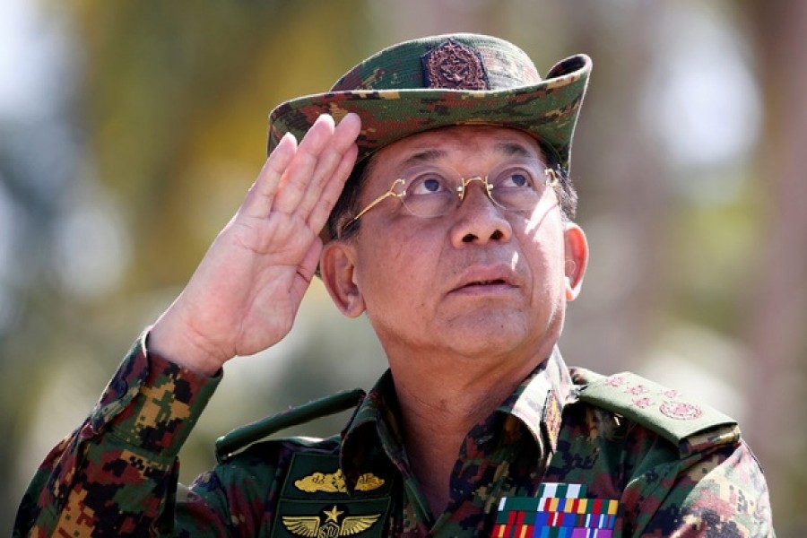 FILE PHOTO: Myanmar military commander-in-chief, Senior General Min Aung Hlaing, salutes while attending a military exercise at Ayeyarwaddy delta region in Myanmar, February 3, 2018. REUTERS/Lynn Bo Bo/Pool/File Photo