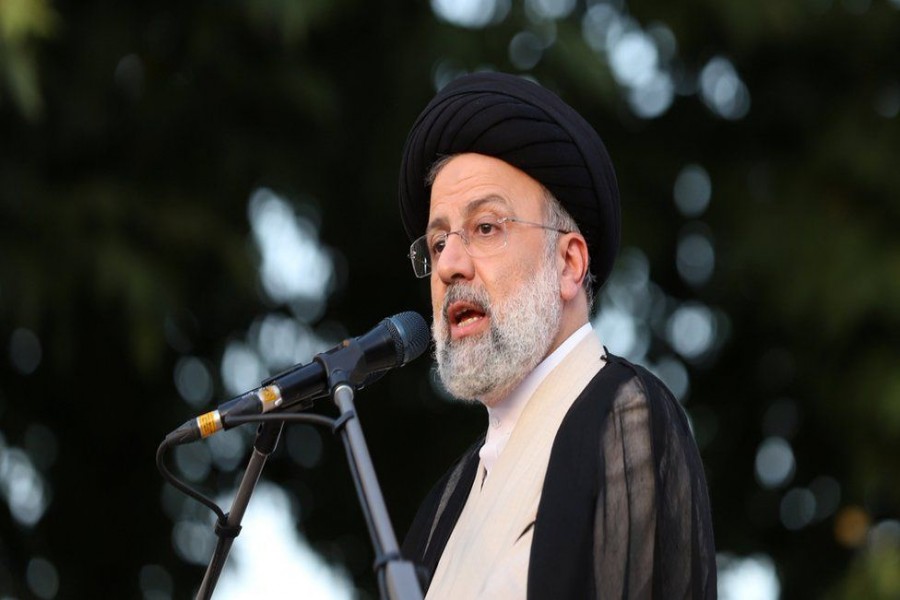 Ebrahim Raisi wears a black turban identifying him as a descendant of the Prophet Muhammad