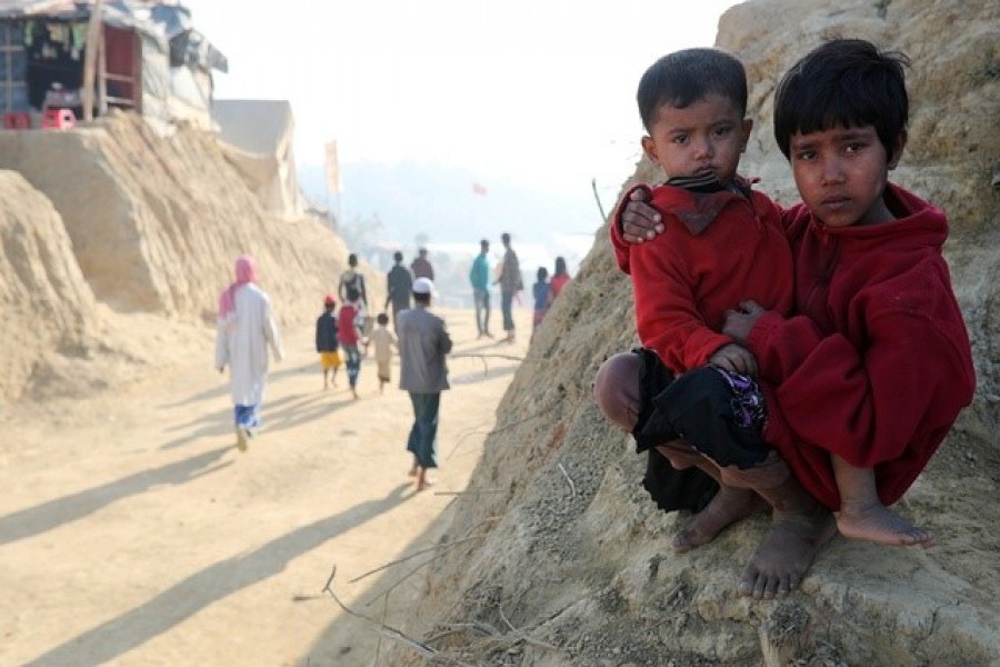 Rohingya refugee children look on at the Jamtoli camp in the morning in Cox's Bazar, Bangladesh, January 22, 2018 — Reuters/Files