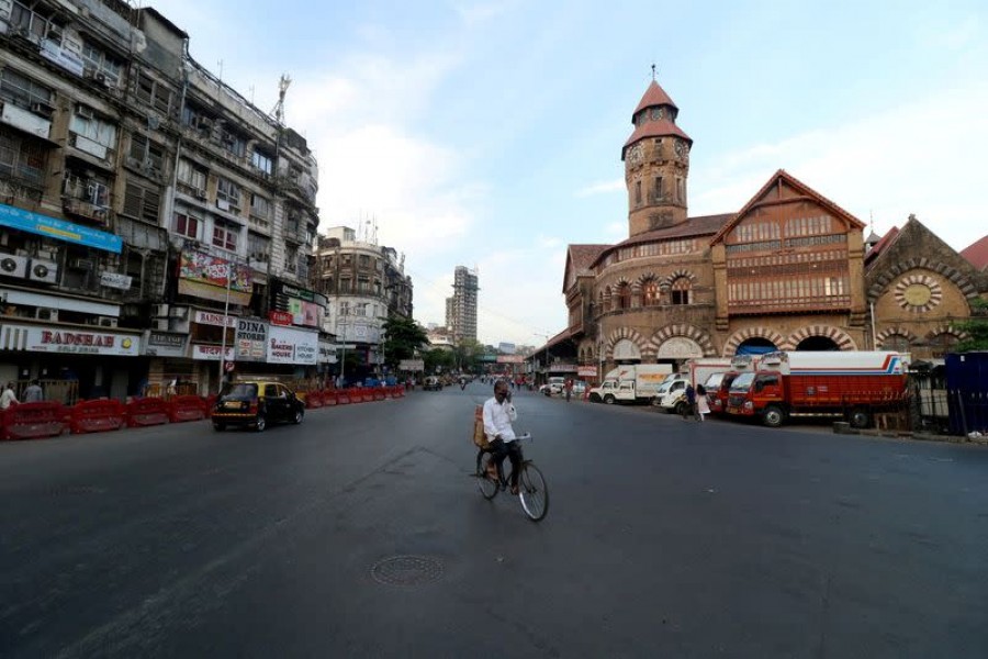 A man rides his bicycle during a lockdown to limit the spread of the coronavirus disease (Covid-19) in Mumbai, India on April 23, 2021 — Reuters/Files